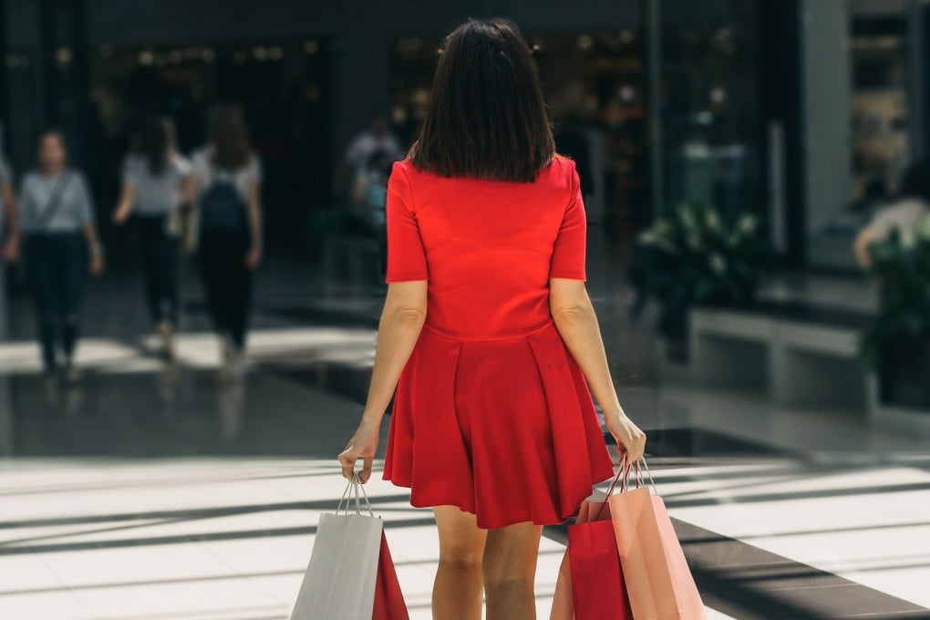 Woman shops at a busy mall. Photo: Shutterstock/File