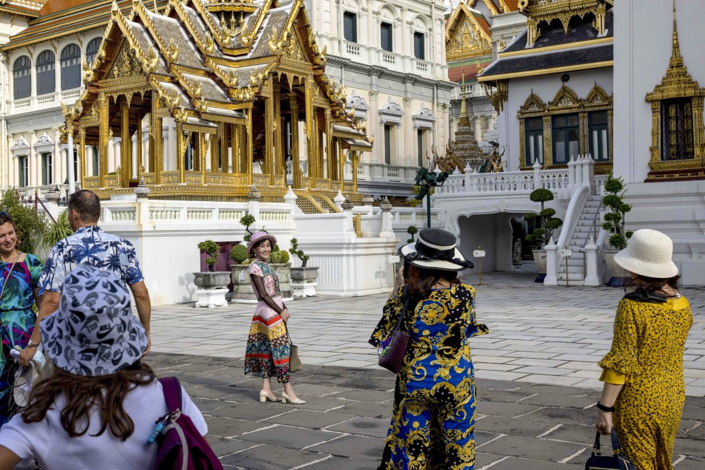 Tourists at the Grand Palace in Bangkok on July 18. The return of Chinese tourists will boost economies such as Thailand’s and support their currencies. Photo: AFP