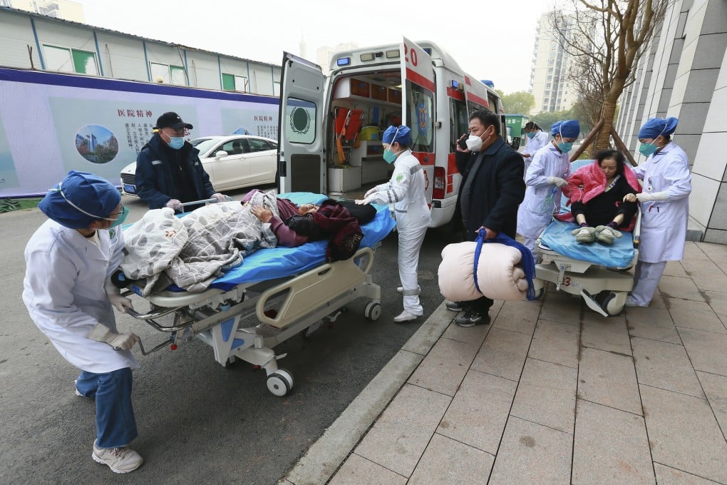 Medical workers receive patients arriving in ambulances at a hospital in Suining, in southwestern China’s Sichuan province. Photo: AP
