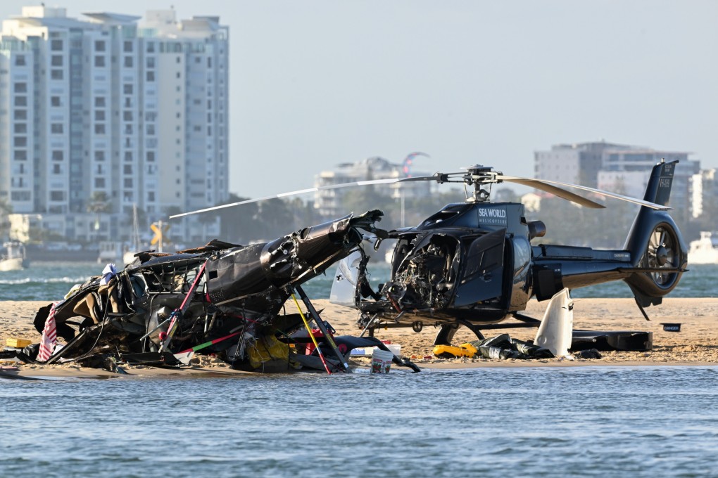 One helicopter lay flipped over on the sand a few feet from the shore. The other chopper appeared to be largely intact at the accident scene. Photo: EPA-EFE