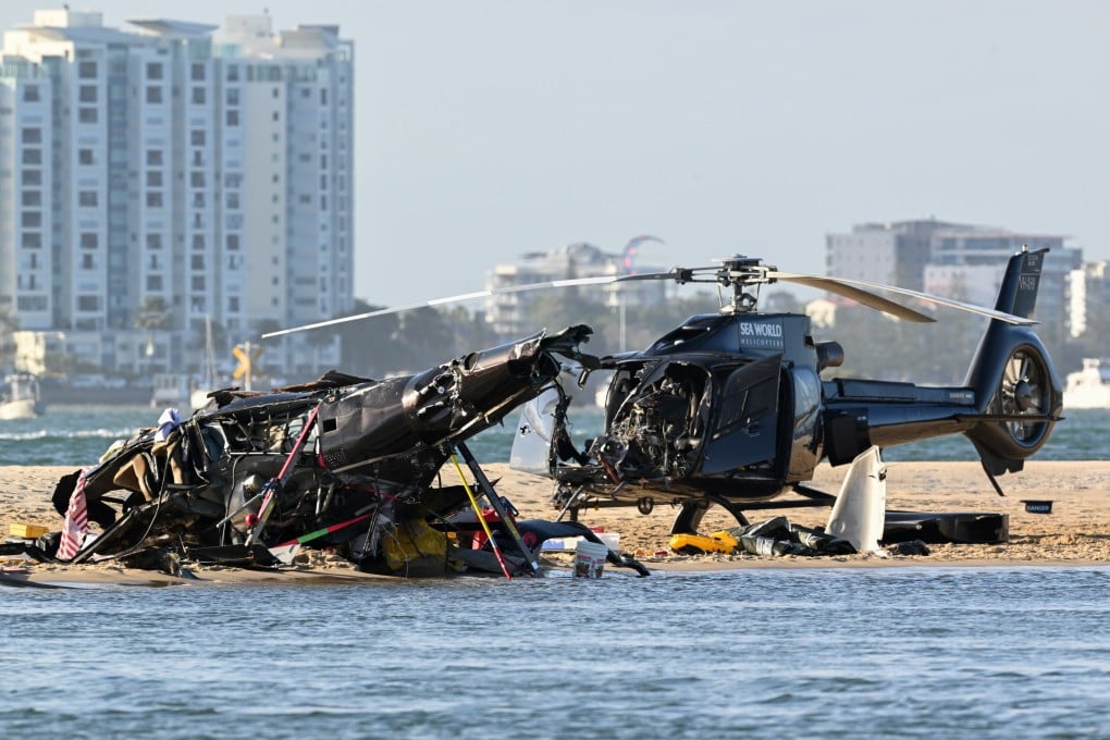 One helicopter lay flipped over on the sand a few feet from the shore. The other chopper appeared to be largely intact at the accident scene. Photo: EPA-EFE