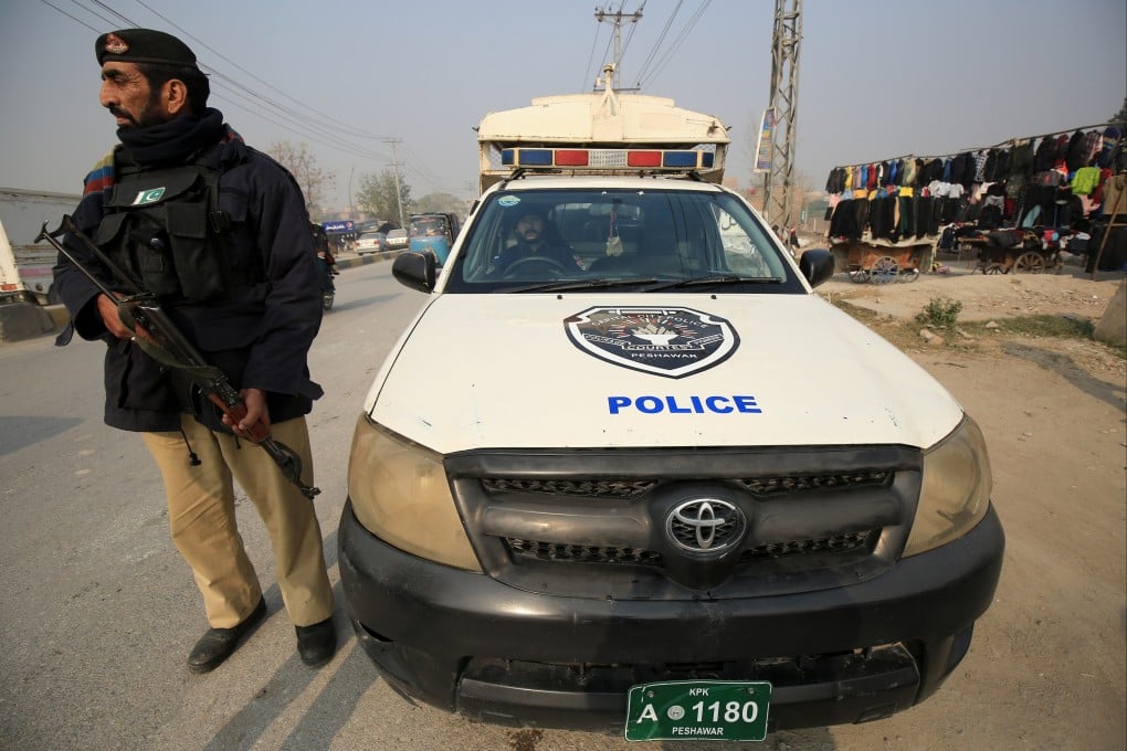 Pakistani security officials stand guard on December 24 at a checkpoint following a security high-alert, a day after a suicide blast in Islamabad. Pakistan’s civil and military leadership late Monday issued a warning that “the full force of the state” would “take on all and any entities that resort to violence”. Photo: EPA-EFE