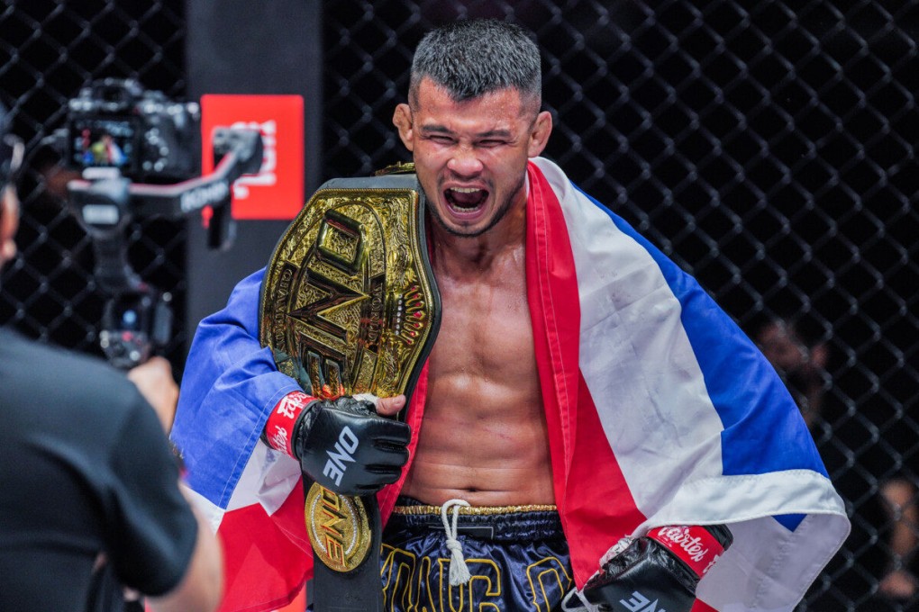 Thailand’s Nong-O Gaiyanghadao celebrates with the ONE bantamweight Muay Thai belt. Photos: ONE Championship.