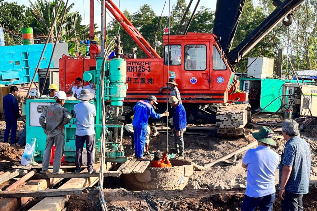 Workers try to rescue a boy trapped in a concrete pillar in Vietnam’s Dong Thap province on Wednesday. Photo:  Dong Thap Provincial Department of Information and Communication via AFP
