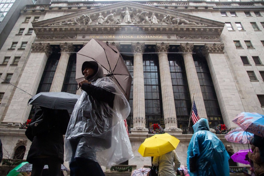 Pedestrians pass the New York Stock Exchange (NYSE) in New York, US, on January 3, 2023. Photo: Bloomberg