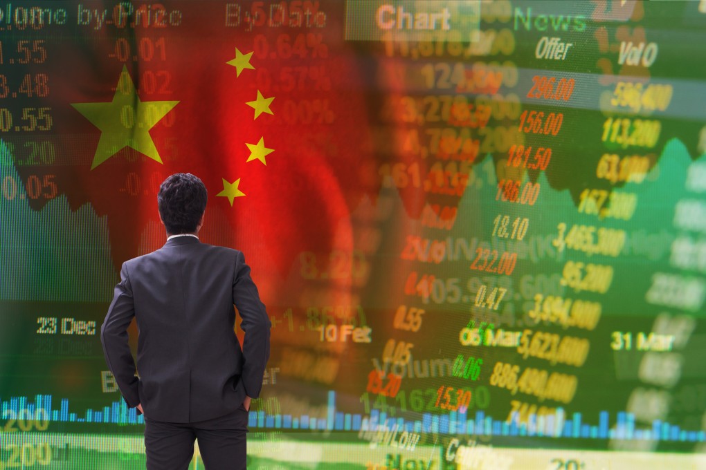 A businessman standing in front of an electronic board showing Chinese stock prices. Photo: Shutterstock Images
