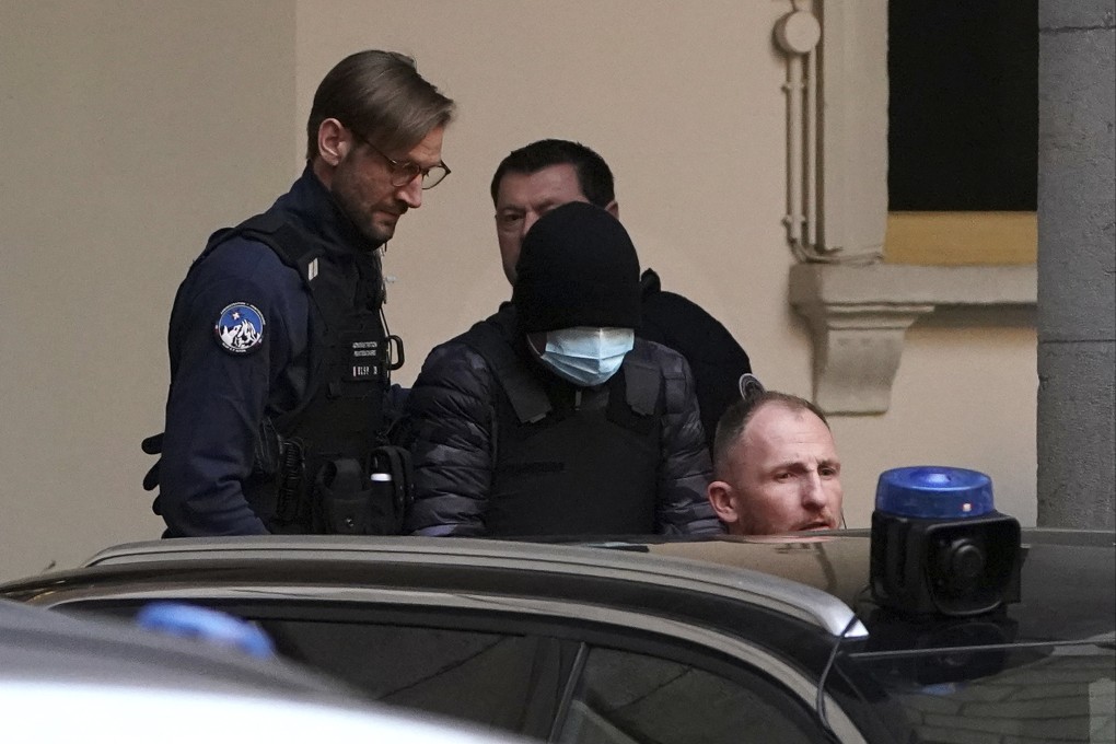 Ukrainian businessman and former politician Kostiantyn Zhevago, wearing a mask and a cap (centre), after appearing at the court house of Chambery in the French Alps on Thursday. Photo: AP