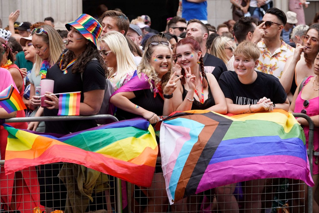 Spectators line the route as the LGBT community takes part in the annual Pride parade in London, in July 2022. Photo: AFP
