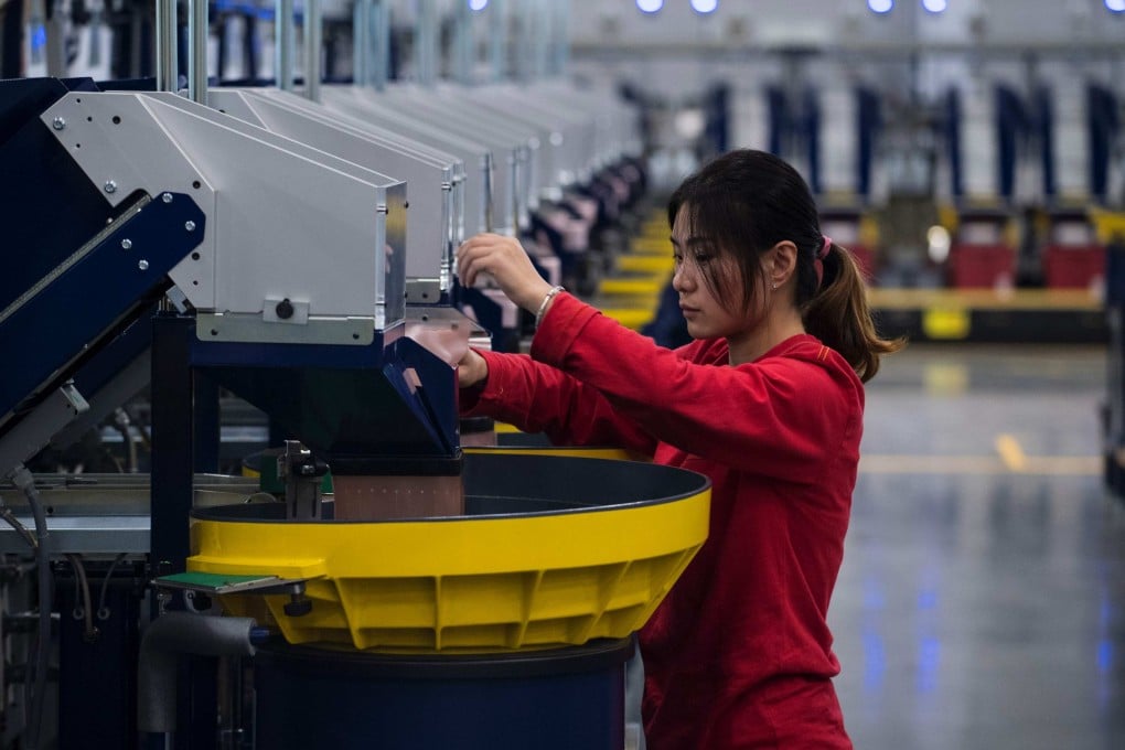 A worker checks the packaging production line at Lego’s first Asian factory in Jiaxing. The Danish toy giant opened a new facility in Vietnam last year. Photo: AFP