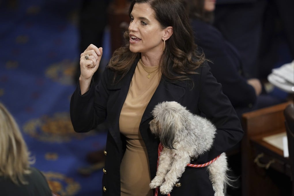 US congresswoman Nancy Mace holds her dog after the eleventh vote for House speaker in Washington on Thursday. Photo: AP
