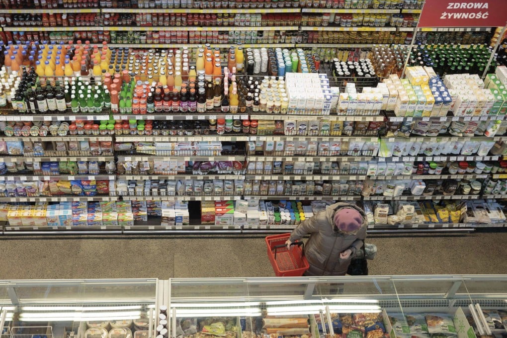 A shopper in a supermarket in Warsaw, Poland, on December 9, 2022. Since the second quarter of 2021, much of the world has been experiencing inflation far above 2 per cent. Photo: AP