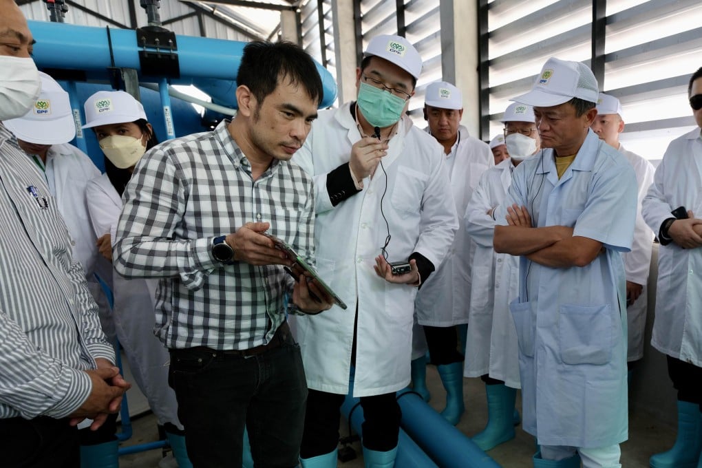 An undated photograph of Jack Ma (third right) looking at a shrimp farm in Thailand. Photo: Handout