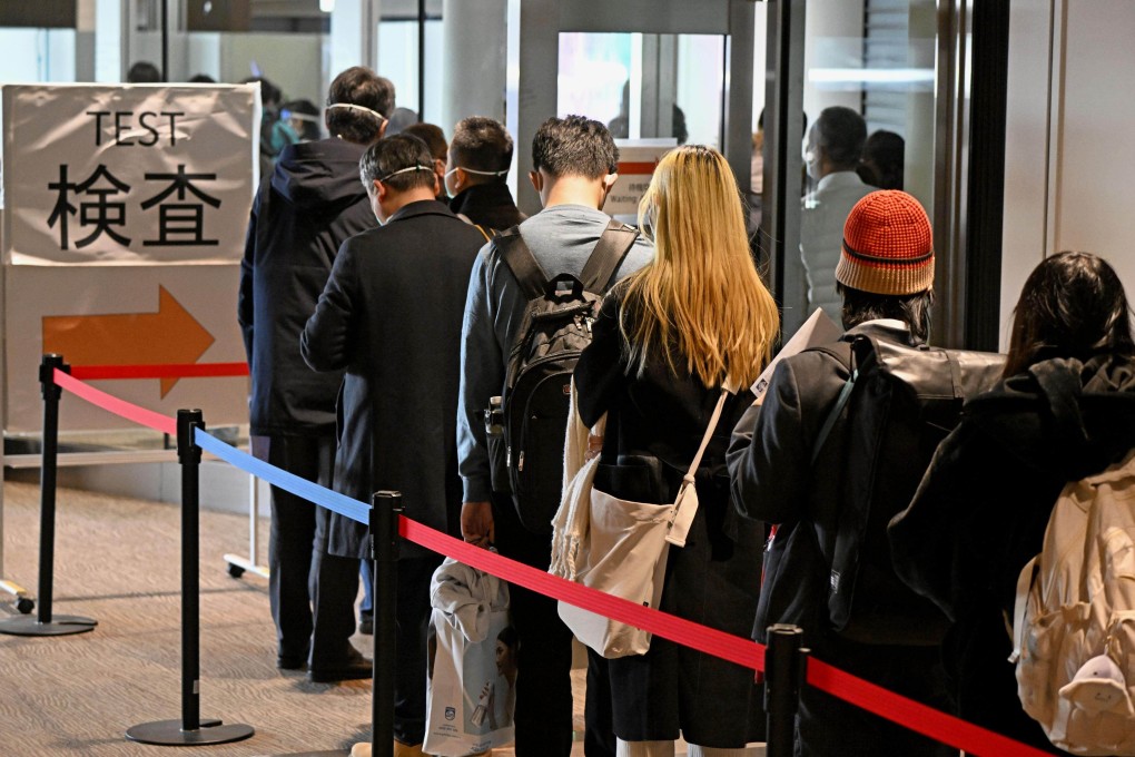 Passengers from Shanghai line up to take a more sensitive Covid-19 antigen test at Narita airport near Tokyo on January 8. Photo: Kyodo