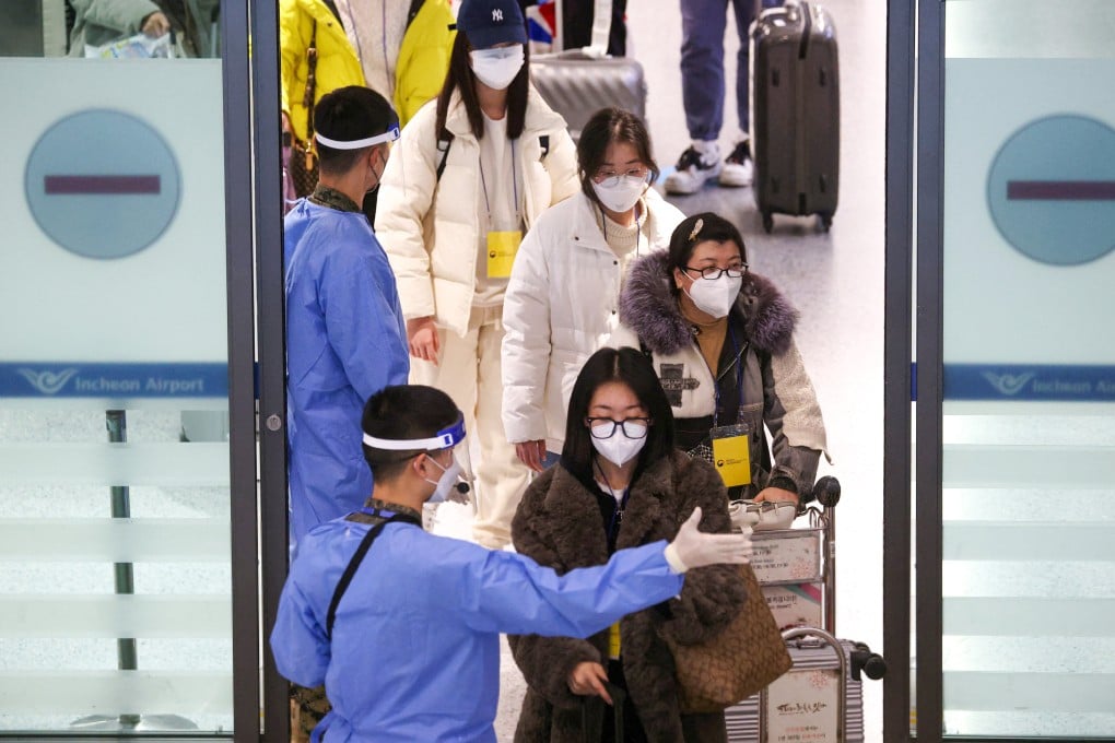 Chinese tourists are guided to get tested on arrival at Seoul’s Incheon International Airport in South Korea on January 4. Photo: Reuters