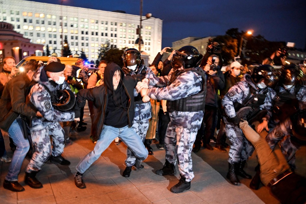 Police officers detain a man in Moscow in September 2022, following calls to protest against the partial mobilisation announced by President Vladimir Putin. Photo: AFP