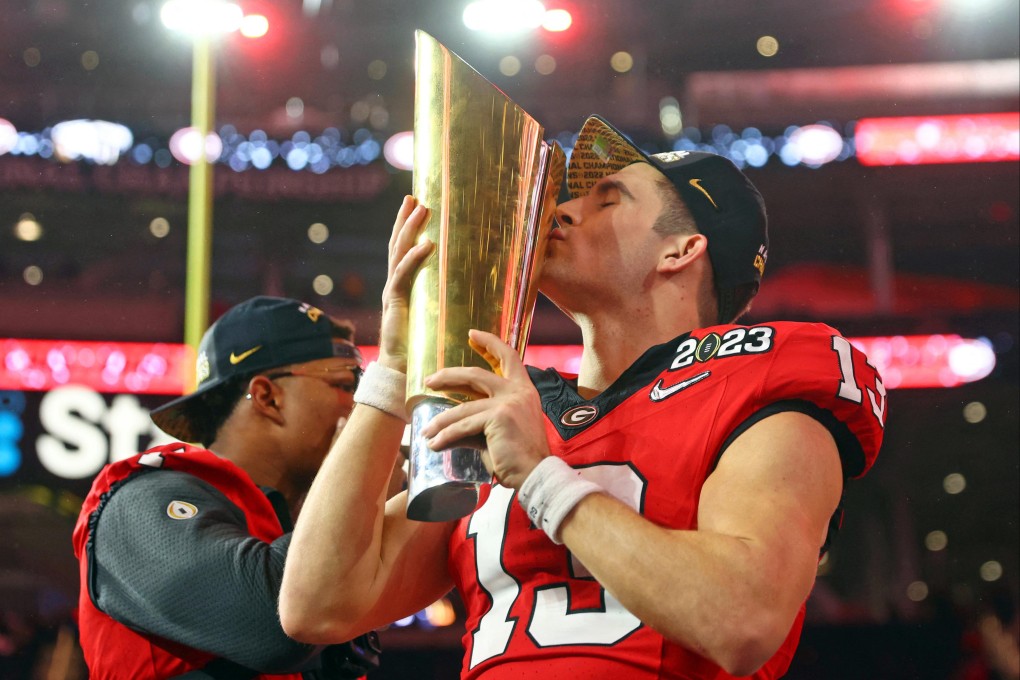 Georgia quarterback Stetson Bennett kisses the trophy after winning the CFP national championship game TCU. Photo: USA TODAY Sports