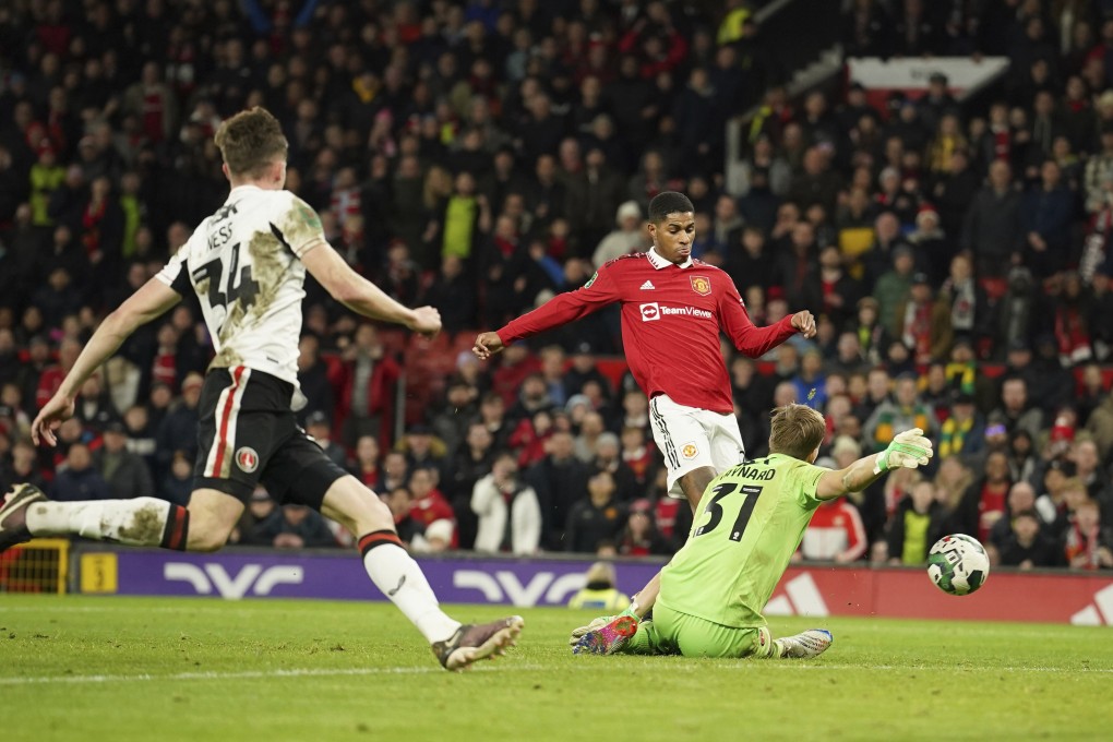 Manchester United’s Marcus Rashford scores his side’s second past Charlton’s goalkeeper Ashley Maynard-Brewer. Photo: AP