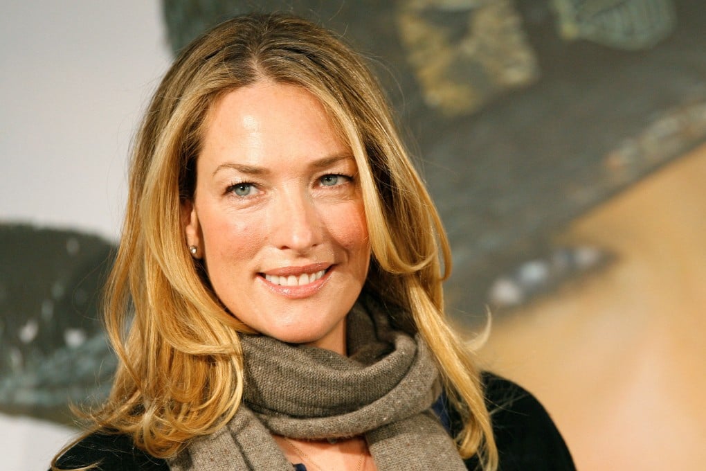 German model Tatjana Patitz smiles as she presents the new catalogue of the Otto group in Hamburg in December 2006. Photo: Reuters