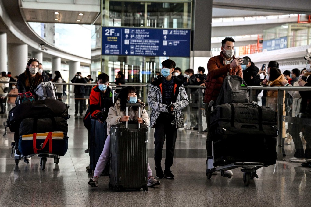 International arrivals make their way out of Beijing airport as entry restrictions are lifted on January 8. Photo: AFP