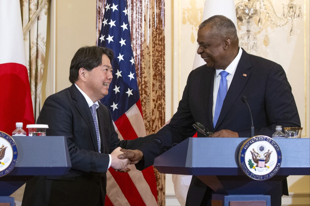 Japanese Foreign Minister Yoshimasa Hayashi shakes hands with US Defence Secretary Lloyd Austin following bilateral security talks in Washington on Wednesday. Photo: EPA-EFE