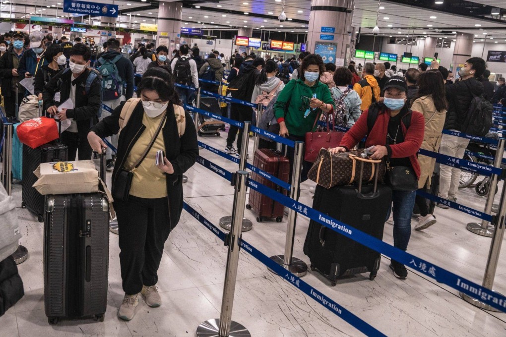 Travellers queue in the border control area at Lok Ma Chau station on January 8, the first day the border with the mainland was reopened for quarantine-free travel. Photo: Bloomberg