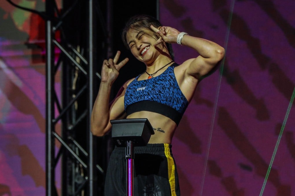 Stamp Fairtex poses on the scale at the ONE Fight Night 6 ceremonial weigh-ins. Photos: ONE Championship