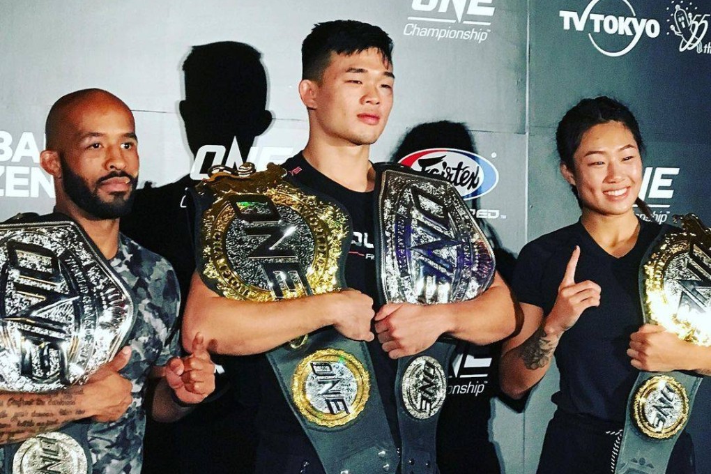 Demetrious Johnson (left) with Christian Lee and Angela Lee after their victories at ONE Century in Tokyo on October 12, 2019. Photo: Nicolas Atkin