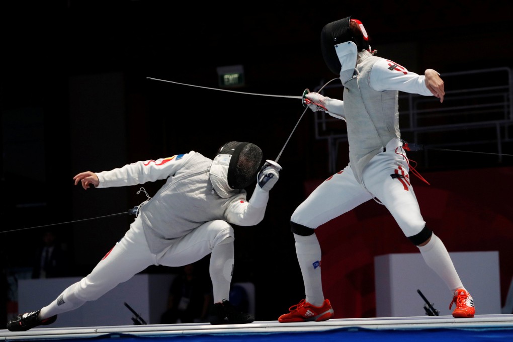 Nicholas Choi (right) against Huang Mengkai of China in the individual foil final at the 2018 Asian Games. Photo: Reuters