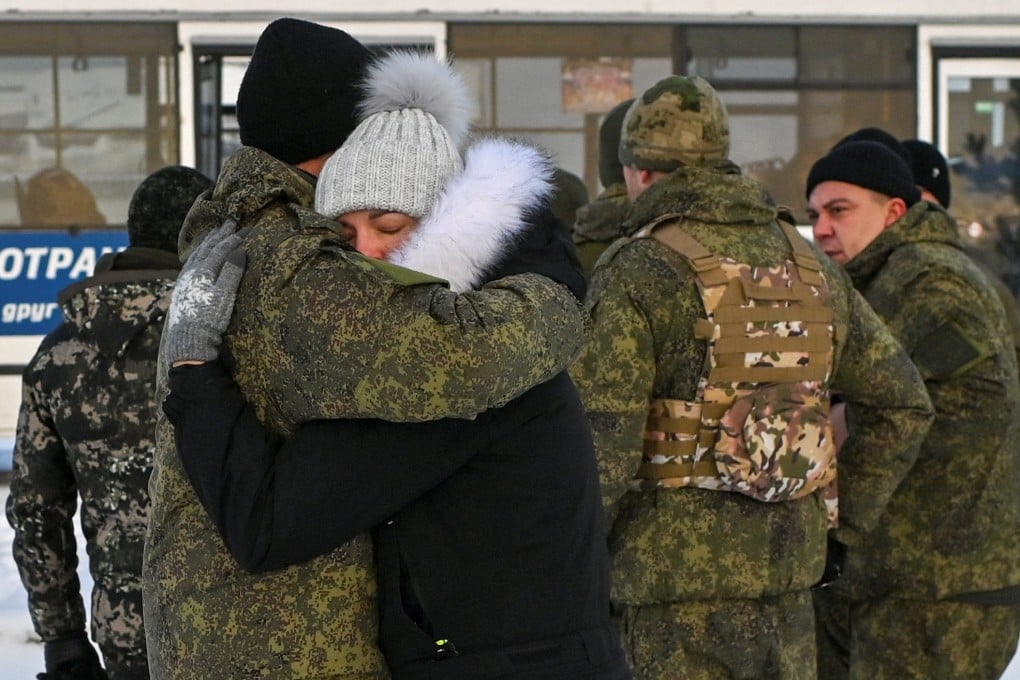 A Russian reservist called up in Putin’s partial mobilisation bids farewell to relatives and acquaintances in Omsk on January 6. Photo: Reuters