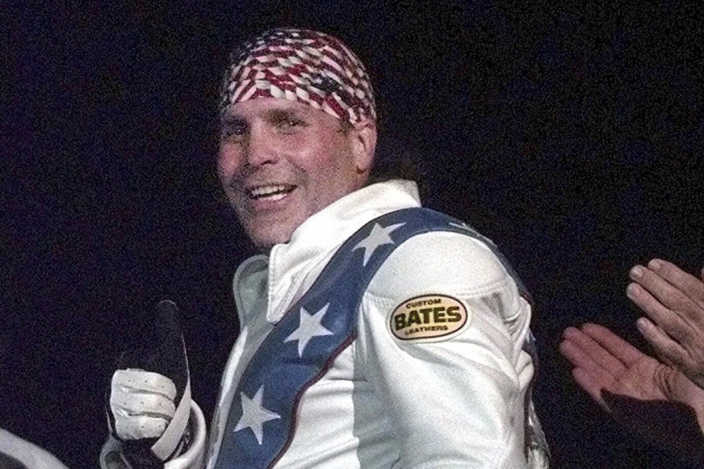 Robbie Knievel gives a thumbs up after jumping a train at the Texas State Railroad Park in Palestine, Texas, in February 2000. Photo: AP