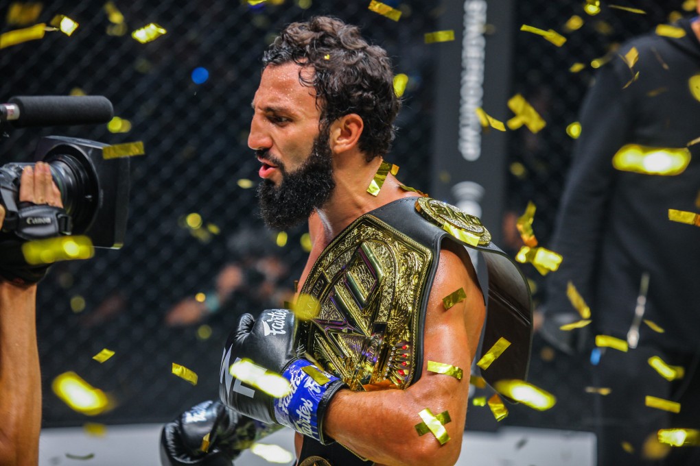 Chingiz Allazov celebrates after winning the ONE featherweight kickboxing belt. Photos: ONE Championship.
