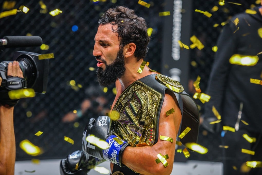 Chingiz Allazov celebrates after winning the ONE featherweight kickboxing belt. Photos: ONE Championship.