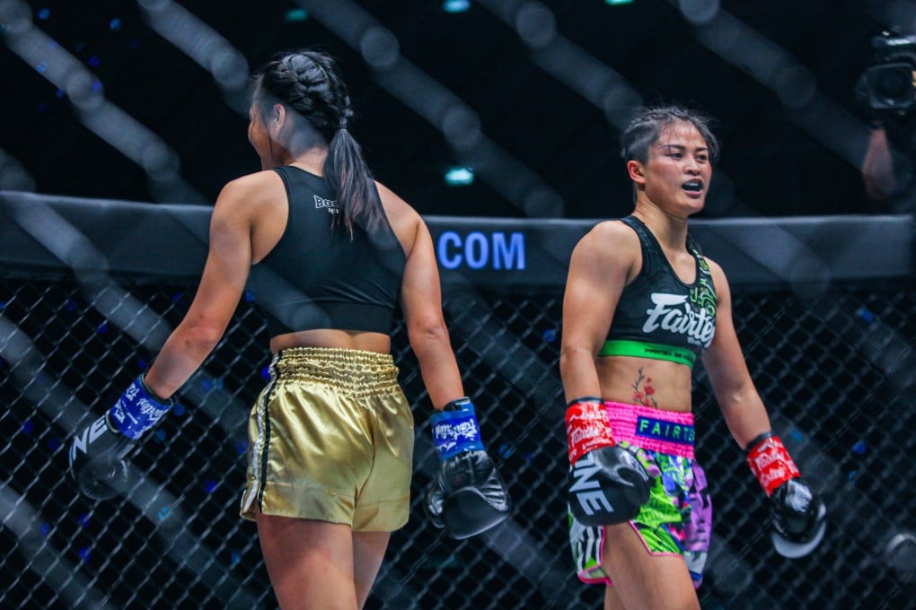 Supergirl Jaroonsak (left) and Stamp Fairtex walk back to their corners at the end of their kickboxing fight. Photos: ONE Championship.