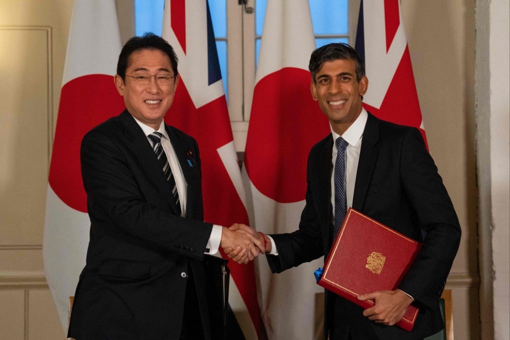 Britain’s Prime Minister Rishi Sunak and Japan’s Prime Minister Fumio Kishida shake hands after signing a defence agreement during a bilateral meeting at the Tower of London. Photo: AFP