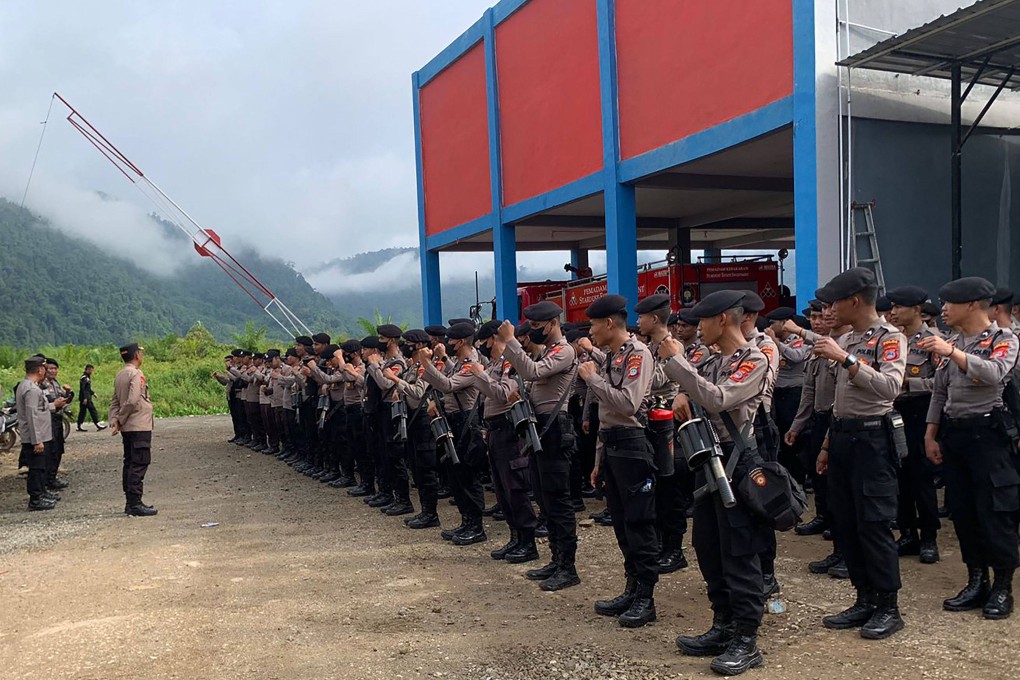 Police shows take up positions after two workers, including a Chinese national, were killed at a nickel smelting plant in North Morowali, Sulawesi after a riot broke out during a protest over labour conditions. Photo: Morowali Police/AFP/Handout