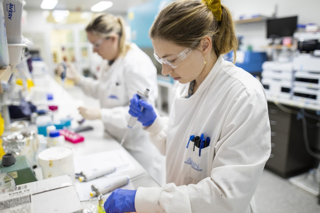 Researchers work in a lab at the University of Queensland, in Brisbane, Australia. Global challenges such as pandemics need global solutions. Photo: Handout