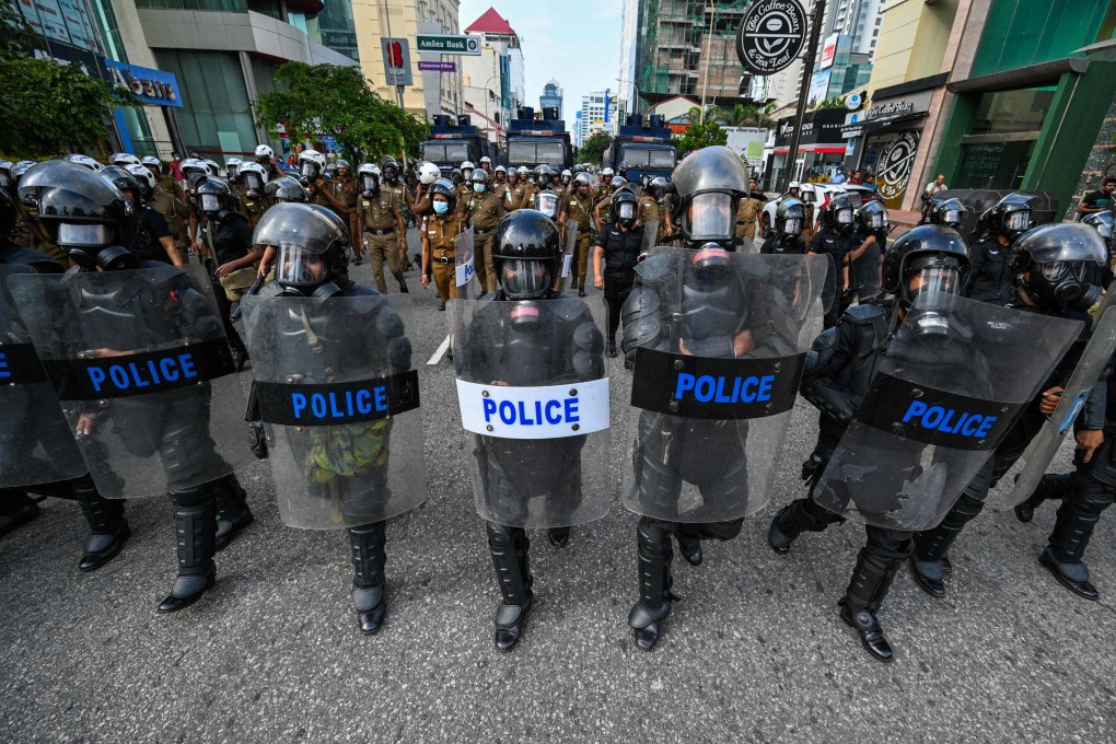Police gather during an anti-government demonstration in Colombo, Sri Lanka, on Sunday. Photo: AFP