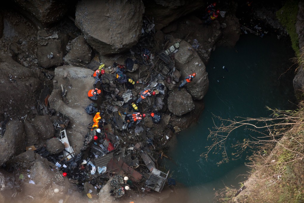 Rescuers on Tuesday work at the crash site of the Yeti Airlines plane that plummeted into a gorge near Pokhara, Nepal, killing all 72 people on board. Photo: Xinhua