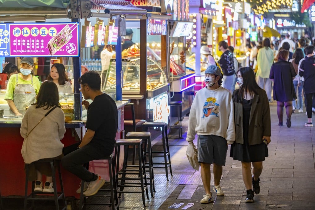 Tourists visit Nanqiang Street in Kunming, southwest Yunnan province, on October 5, 2022. China’s economic engine is beginning to heat up again. Photo: Xinhua
