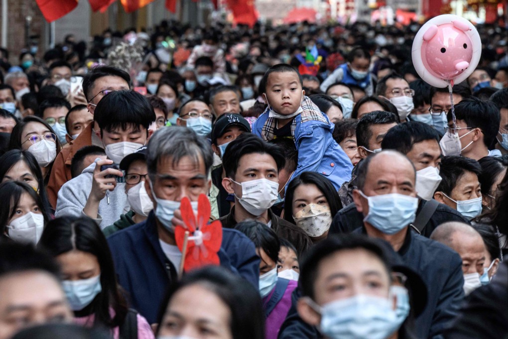 Crowds pictured at a traditional flower market in the southern city of Guangzhou on Friday. Photo: AFP