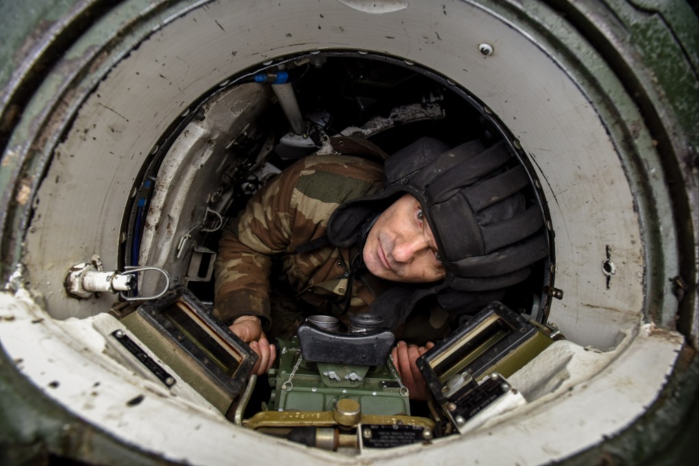 A Ukrainian soldier in a Soviet-era T-72 tank in the Donetsk region, eastern Ukraine. Photo: EPA-EFE
