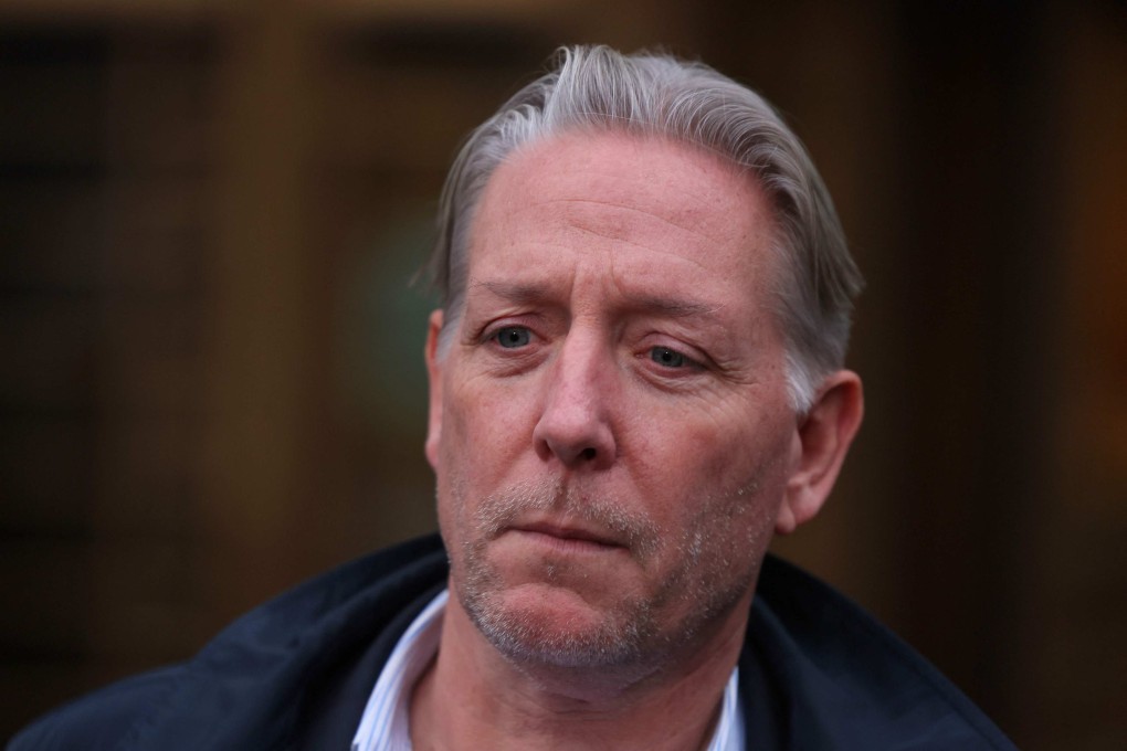 Charles McGonigal, the former head of counterintelligence for the FBI’s New York office, stands silently as his lawyer gives a statement to the media in New York on Monday. Photo: AFP