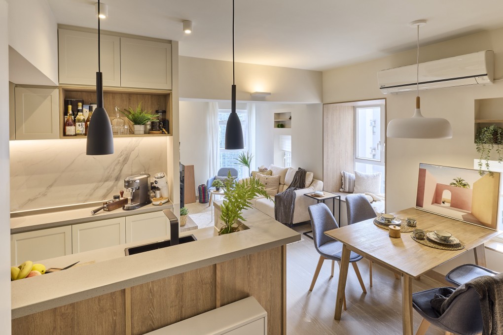 The kitchen, dining and sitting areas of Kenneth Yuen and Sabrina Jensen’s redesigned 397 sq ft apartment in Hong Kong’s Wan Chai district. Photo:  Michael Perini
