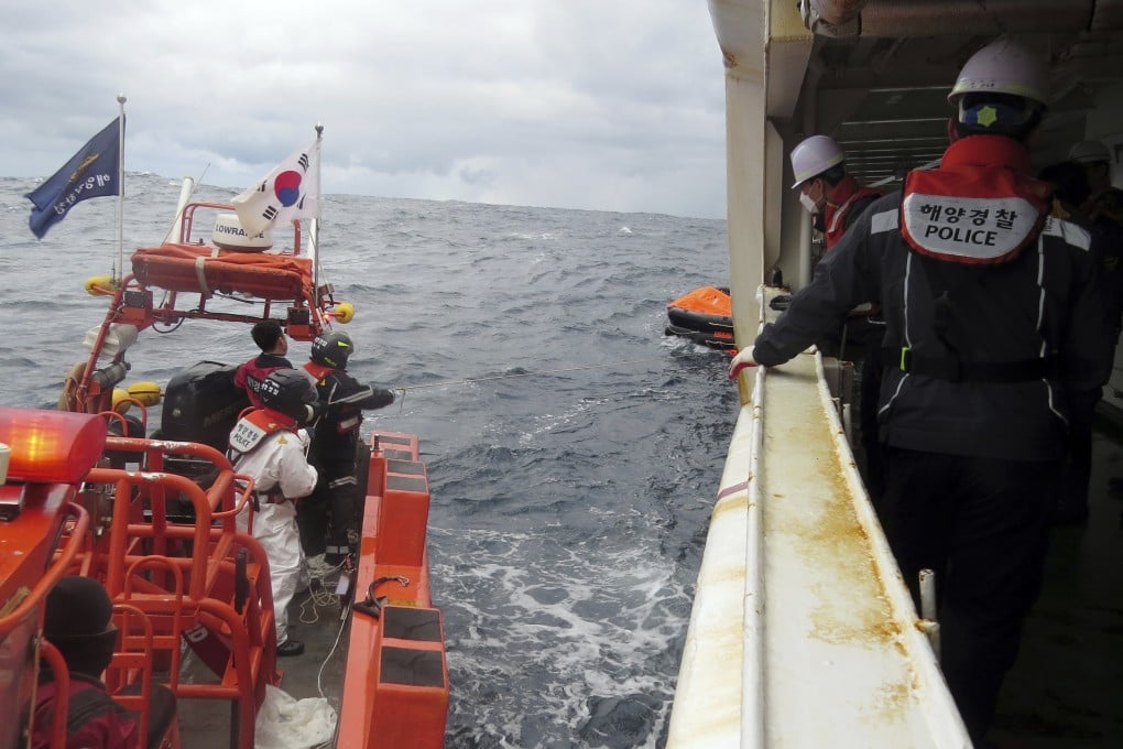 Members of South Korea’s coastguard search for survivors of the Hong Kong-flagged cargo ship Jin Tian, which sank west of Japan’s remote Danjo islands early on Wednesday morning. Photo: The Korea Coast Guard via AP
