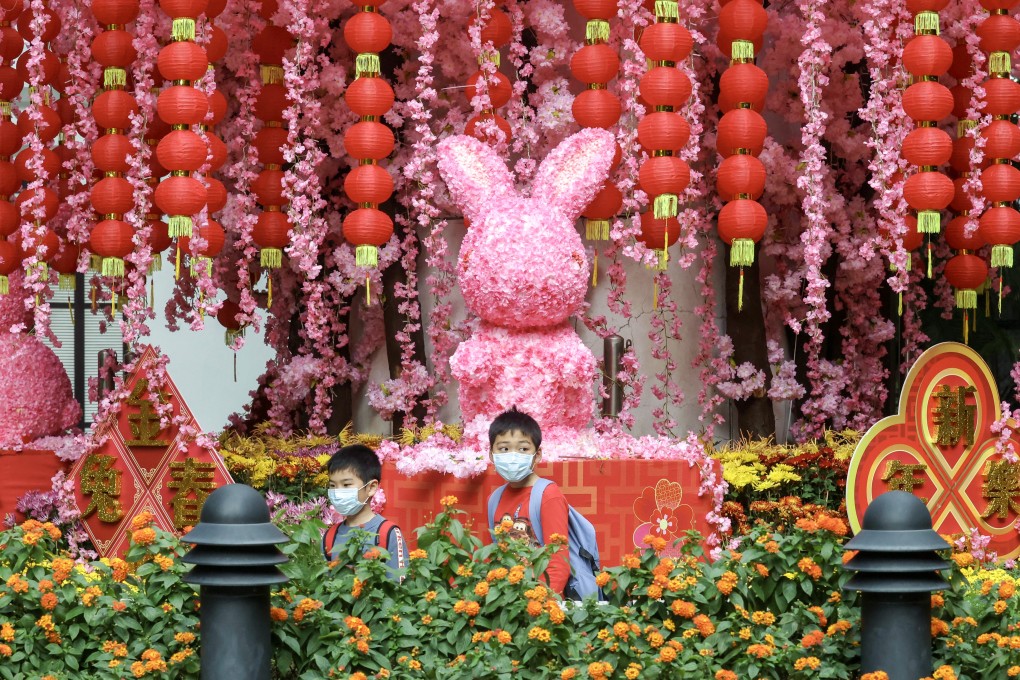 Children walk past a Lunar New Year decoration in Hong Kong Park in Admiralty on January 23. Photo: Jonathan Wong