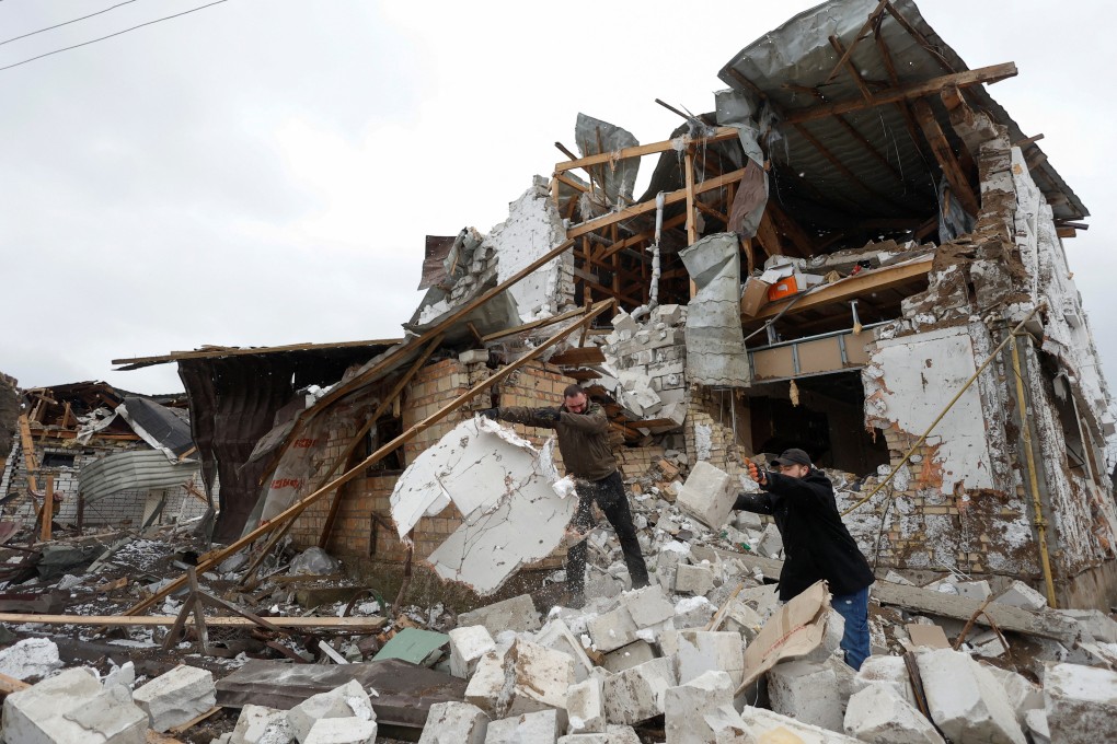 Local residents remove debris from a house in the town of Hlevakha, outside Kyiv, that was damaged by a Russian military strike on Ukraine on Thursday January 26. Photo: Reuters