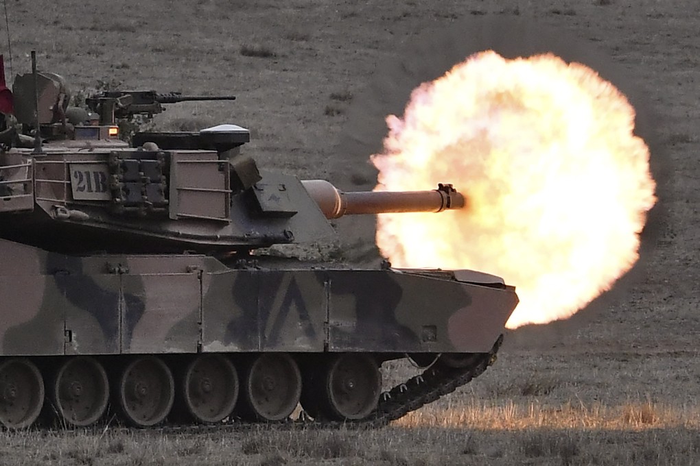 An Australian army M1A1 Abrams main battle tank fires a round at a target at the Puckapunyal Military Base north of Melbourne in May 2019. Photo: AFP
