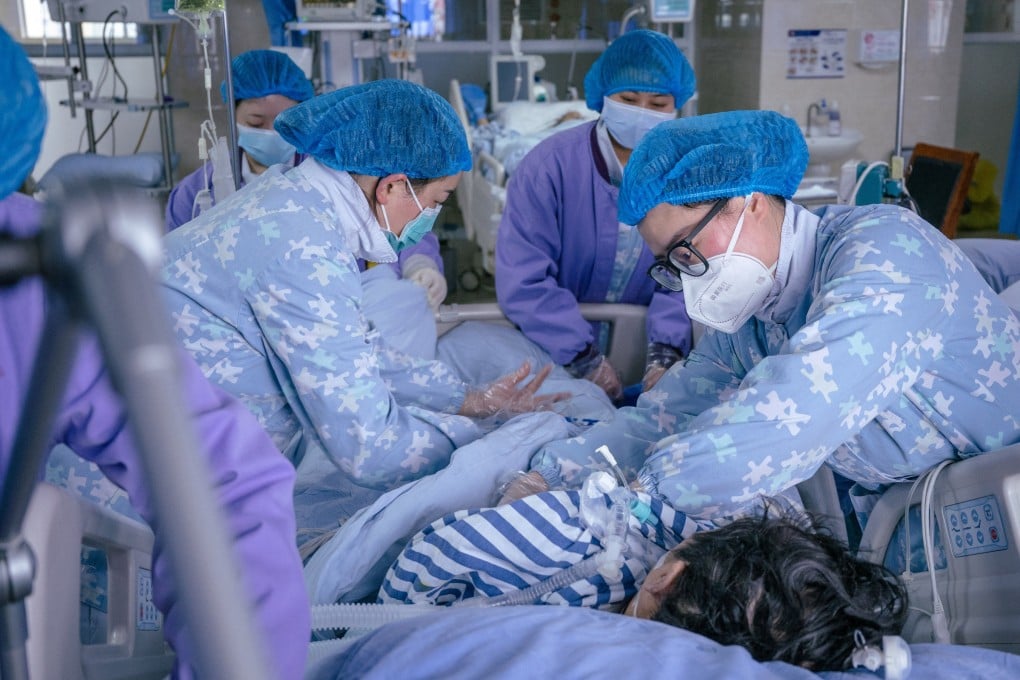 Medical workers treat a Covid patient at a hospital in China’s Sichuan province earlier this month. At least 65 million people are thought to have long Covid worldwide. Photo: cnsphoto via Reuters