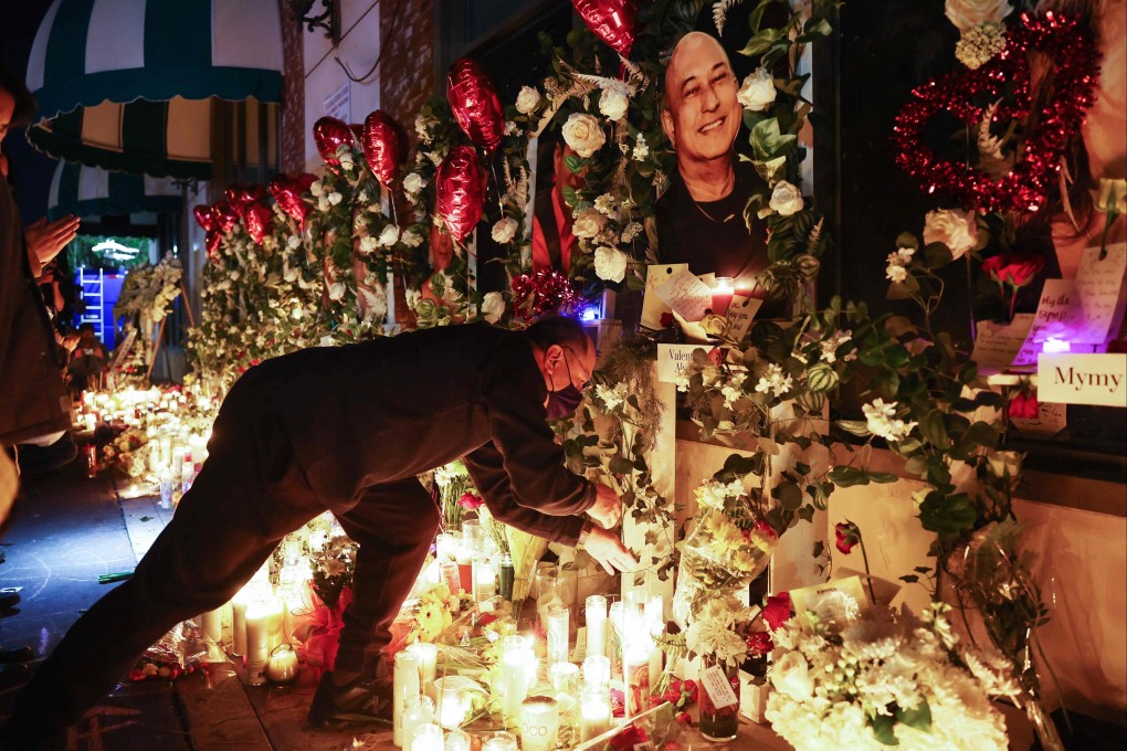 Victims’ pictures are displayed at a candlelight vigil on Wednesday at the growing memorial outside the Star Ballroom Dance Studio in Monterey Park, California. Photo: AFP
