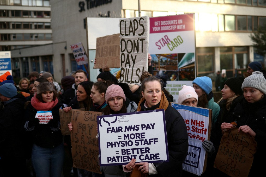 NHS physiotherapists striking outside St Thomas’ Hospital in London on Thursday. Photo: Reuters